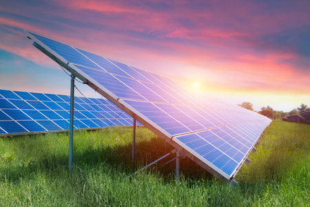 Photo collage of sunset and solar panel