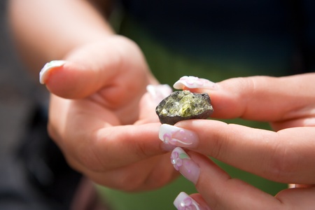 Piece of rock with olivine crystals