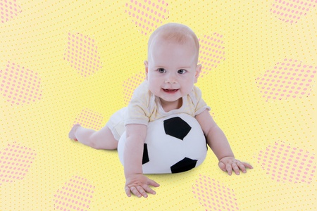 Happy baby playing with a ballの写真素材