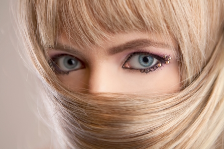 Beautiful woman with blond hair and blue eyesの写真素材