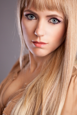 Beautiful woman with blond hair and lovely make-upの写真素材