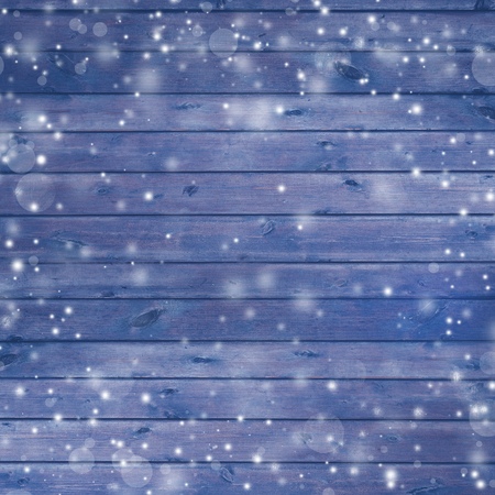 Dark blue new year vintage plank texture with white snowflakes for design and scrapbookingの写真素材
