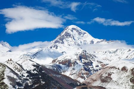 Kazbegi Mountain Winter View with Blue Sky