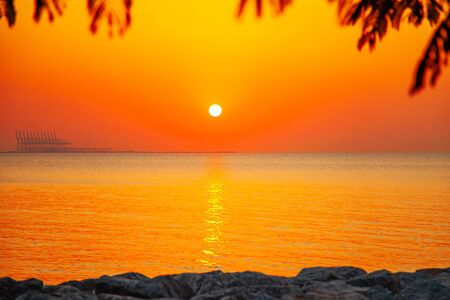 Bright romantic tropical country sea sunset lanscapeの写真素材