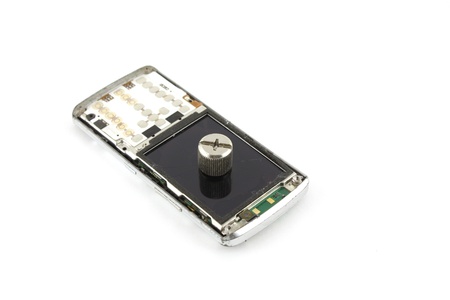 Broken mobile phone over white
