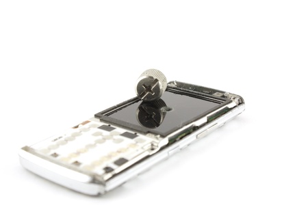 Broken mobile phone over whiteの写真素材