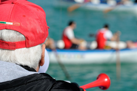 referee canoe race with red capの写真素材