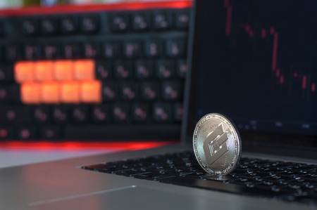 A physical dash cryptocurrency in silver coin. Silver Dash coin in closeup shot.の写真素材