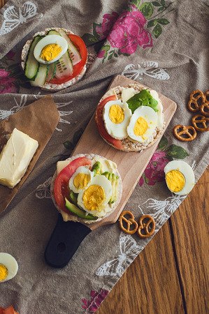 useful breakfast lunch snack with toast avocado tomatoes egg cucumberの写真素材