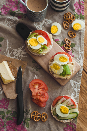 Useful breakfast lunch snack with toast avocado tomatoes egg cucumberの写真素材
