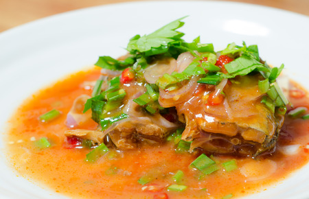 Thai style mackerel spicy salad , topping with coriander の写真素材