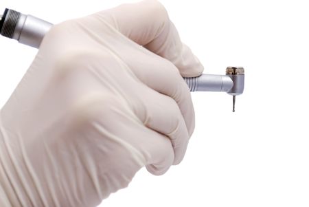 dental drill in hand at the dentistの写真素材