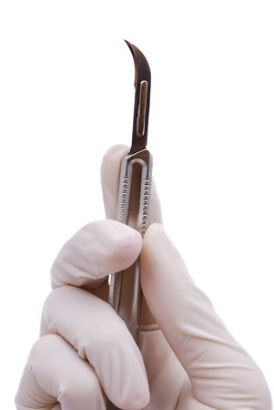 scalpel in his hand the doctor on a white backgroundの写真素材