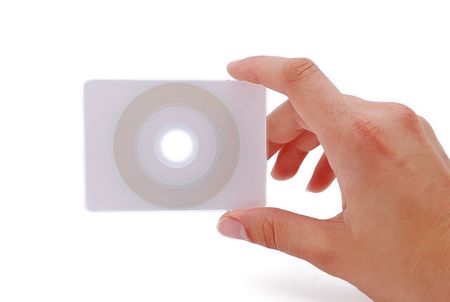 cd business card in his hand on a white backgroundの写真素材