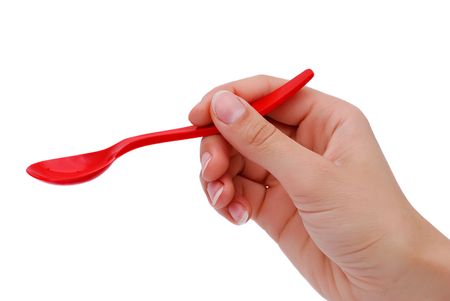 spoon to feed a child in handの写真素材