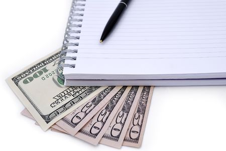 Pen, Notebook and some dollars banknotes isolated on white backgroundの写真素材