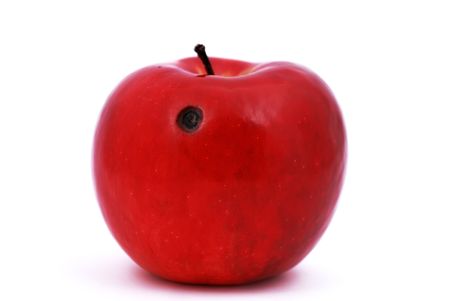 red apple with a ruffled hole on a white backgroundの写真素材