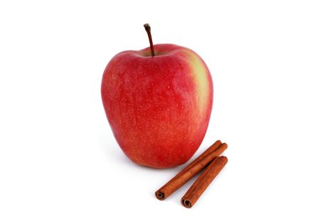 red apple with cinnamon on a white backgroundの写真素材