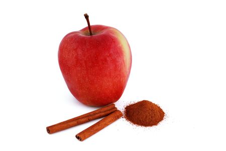 red apple with cinnamon on a white backgroundの写真素材