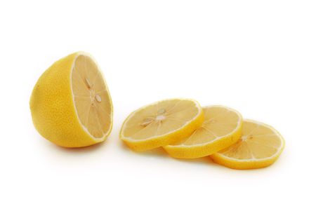 chopped lemon slices on white backgroundの写真素材