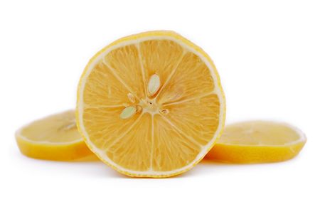 chopped lemon slices on white backgroundの写真素材