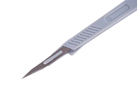 Disposable surgical scalpel on a white backgroundの写真素材