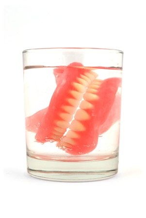 dentures in a glass of waterの写真素材