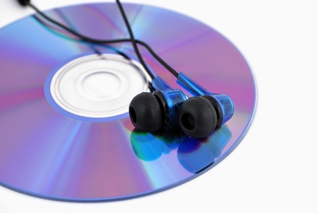 headphones and cd drive on a white backgroundの写真素材