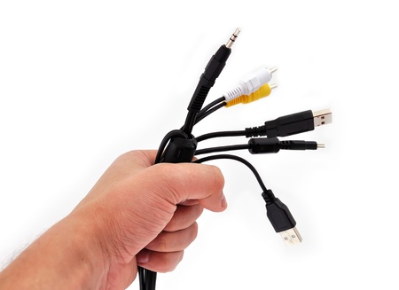 computer wire in his hand on a white backgroundの写真素材