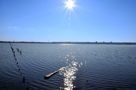 winter landscape: the sky, the sun and the riverの写真素材