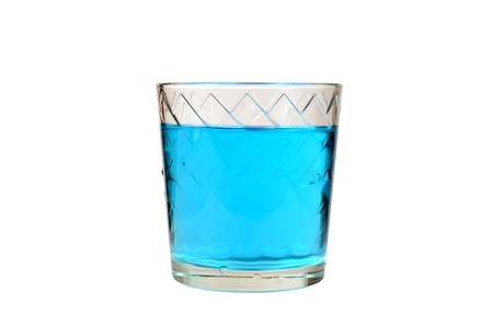glass with a blue fluid on a white backgroundの写真素材