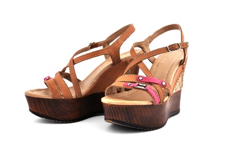 brown ladies shoes on a white backgroundの写真素材