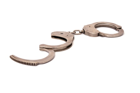 Handcuffs on a white backgroundの写真素材