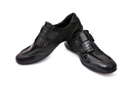 black athletic shoes on white backgroundの写真素材