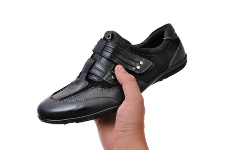 black athletic shoes on white backgroundの写真素材