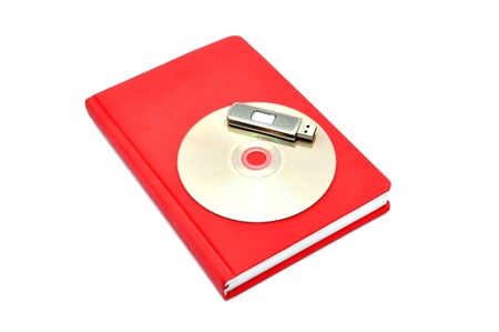 diary, flash drive and cd on a white backgroundの写真素材