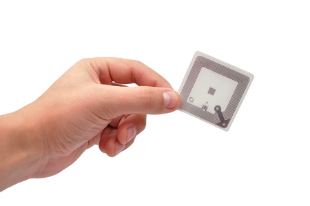 RFID tag in hand  on a white backgroundの写真素材