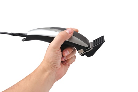 hair shaver in hand    on white backgroundの写真素材