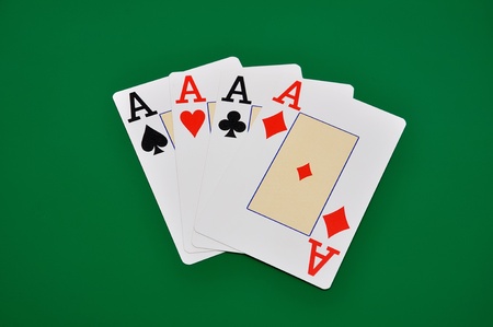 four aces on green backgroundの写真素材