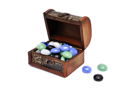 wooden casket with stones  with white backgroundの写真素材