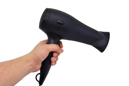 black hairdryer in hand  on white background