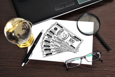 workplace with drawing money on paperの写真素材