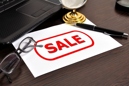 workplace with sale symbol on paperの写真素材