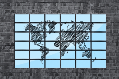 map of world on flat panels on brick wallの写真素材