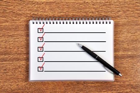 notebook with checklist on tableの写真素材