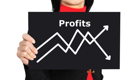woman holding paper with graph of profitの写真素材