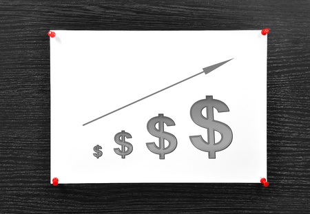 note with dolaars symbol on brown boardの写真素材