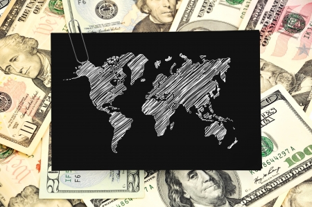 paper with map on background of dollarsの写真素材