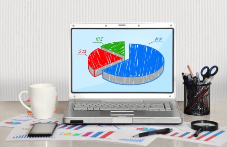 pie chart om screen laptop in officeの写真素材