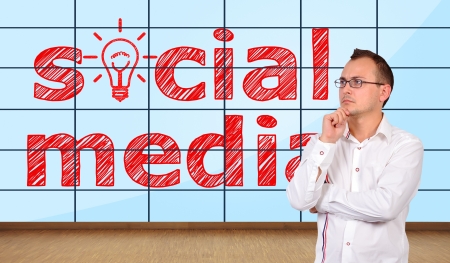 thinking businessman in office and  social media on plasma wallの写真素材